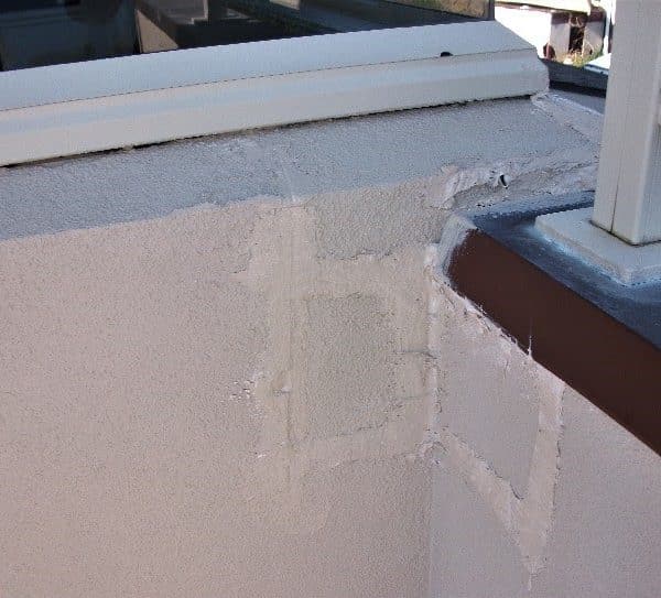 Invasive inspection cut out on a deck showing the damage caused